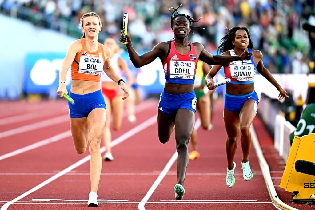 Dominican Republic runner Fiordaliza Cofil wins the mixed 4x400m relay gold medal at the World Athletics Championships