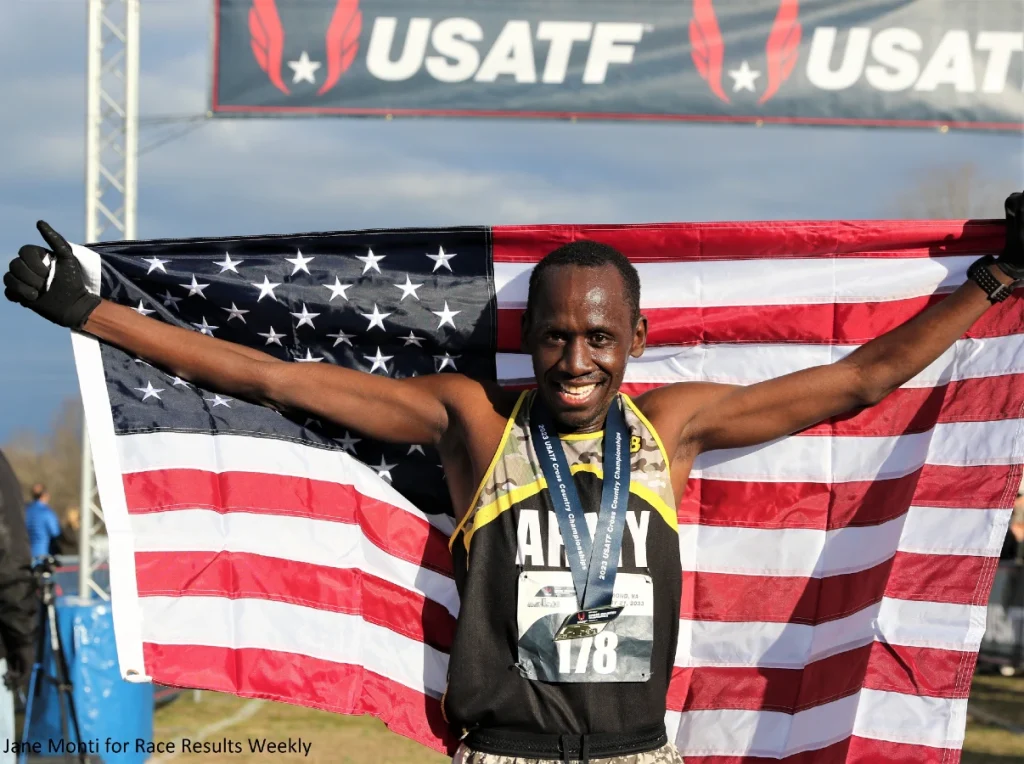 Emmanuel Bor celebrates his open 10-K victory at the 2023 USATF Cross Country Championships