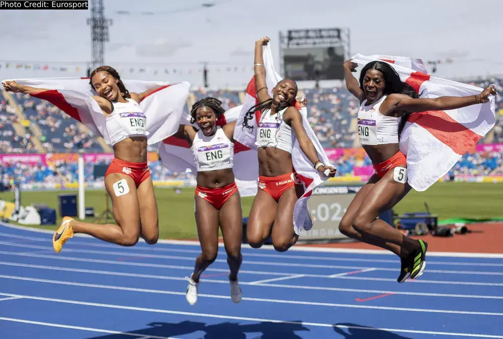 England women 4x100m relay team celebrates Commonwealth Games medal