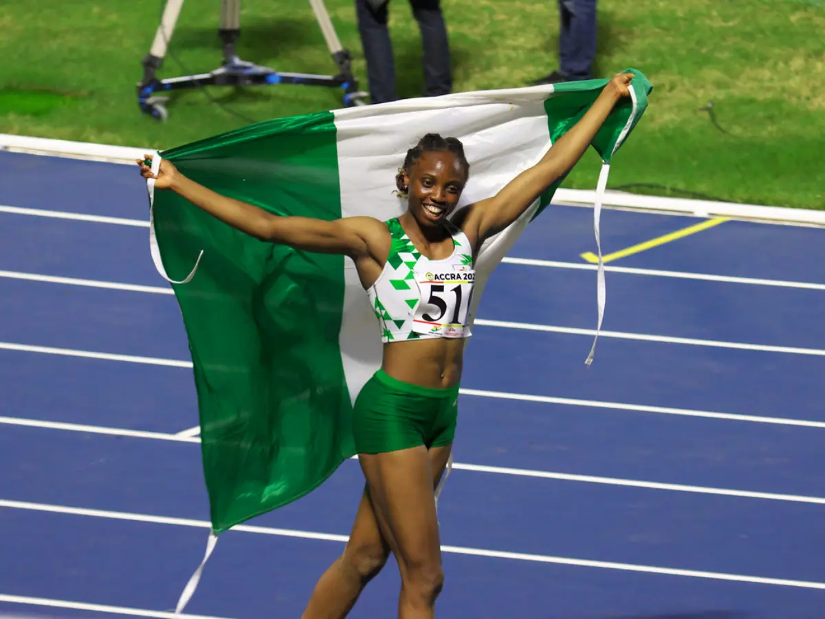 Ruth Usoro of Nigeria celebrates her gold medal at the triple jump