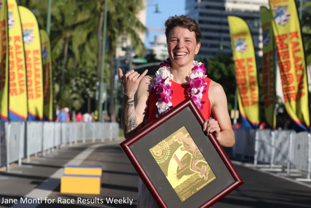 Nikki Hiltz shows off the solid gold Kalakaua Merrie Mile