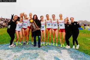 NC State women celebrate after winning the 2025 NCAA cross country 2025.