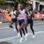 Hellen Obiri, Sharon Lokedi and Sheila Chepkirui after descending the Queensboro Bridge in the 17th mile of the 2025 TCS New York City Marathon